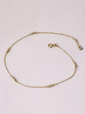 Złota bransoletka na nogę z kuleczkami diamentowanymi pr.585