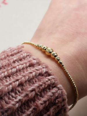 Złota diamentowana bransoletka z kulkami pr.585