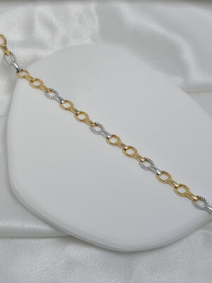 Złota bransoletka z dodatkiem białego złota i cyrkoniami pr.585