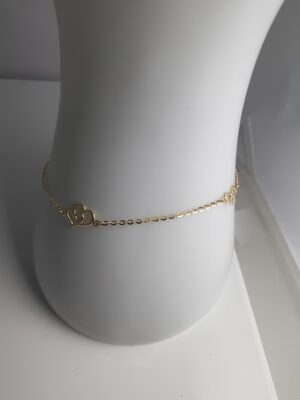 Złota bransoletka z serduszkami i kokardkami pr.585